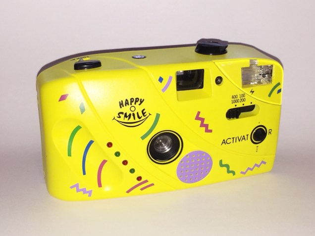 A plastic yellow toy camera.