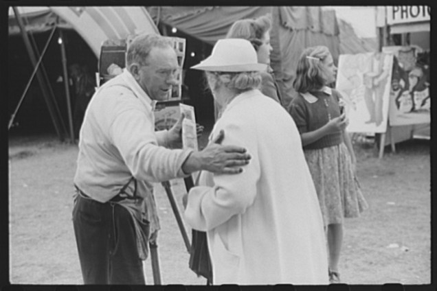 Tintype photographer trying to make a sale at the Champlain Valley Exposition, essex Junction, Vermont. Jack Delano, August 1941.