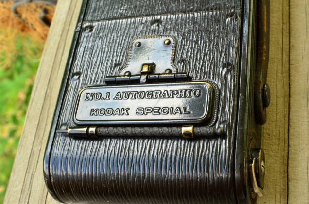 This door opens to reveal the area in which you would press on the film with the metal stylus when using autographic film.  This picture also shows how nice the leather still is on this camera.