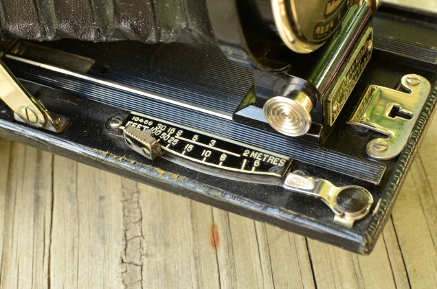 This camera is focused by sliding the lever along the scale. A rack and pinion design moves the lens forward and backward.